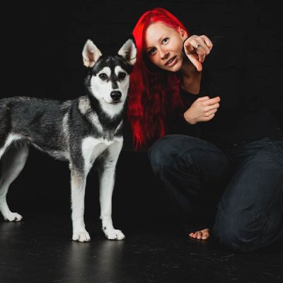 !Code20-woman-red-hair-with-dog-600x600